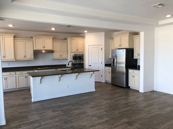 Jasmine Phoenix model home kitchen and pantry stainless steel appliances new homes for sale William