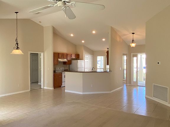 from living room looking at dining area to left, kitchen and enterance