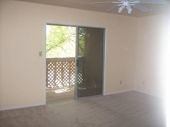 Queen size bedroom with balcony and private bathroom.