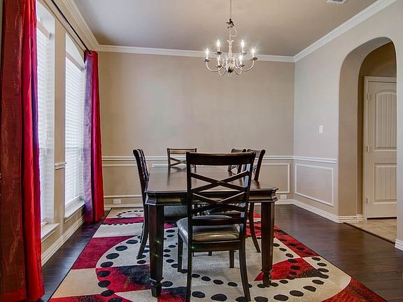 Formal Dining with wood floors, crown molding, chair rail & picture frame molding!