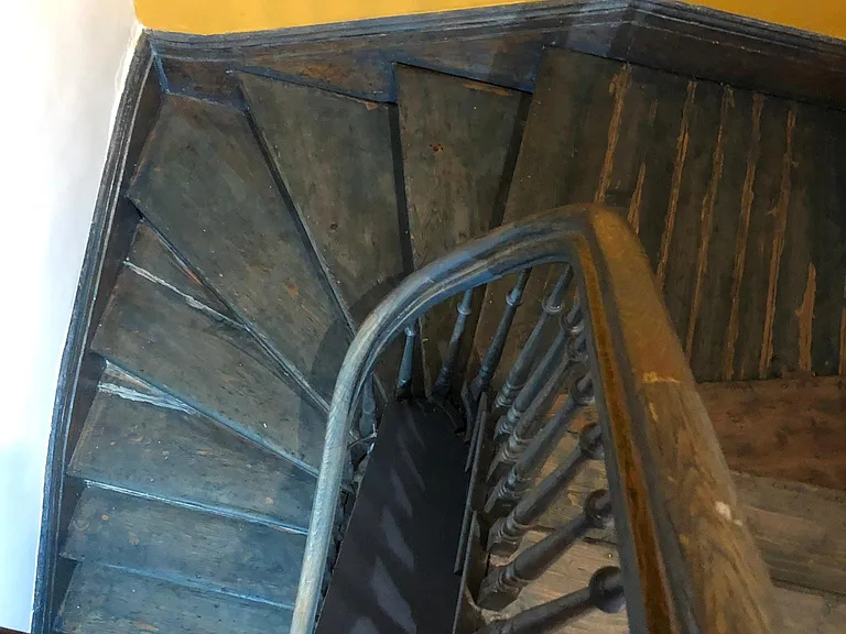 private staircase that leads to the studio.