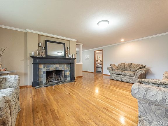 Home features real Hardwood floors and a real wood fireplace.  Home has a very open floor plan.
