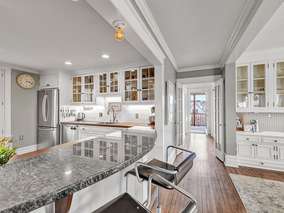Hallway leads to bath on this. level, and on to deck with views of CU Boulder and mountains.