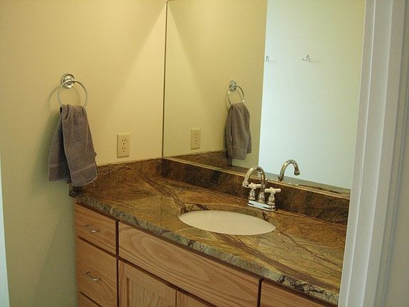 "Rain Forest" granite counters in bath rooms