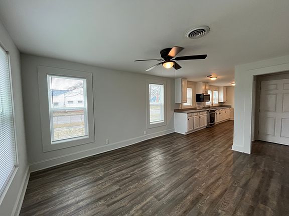 Great room has lots of windows and great natural light. All new blinds throughout the house provide privacy.