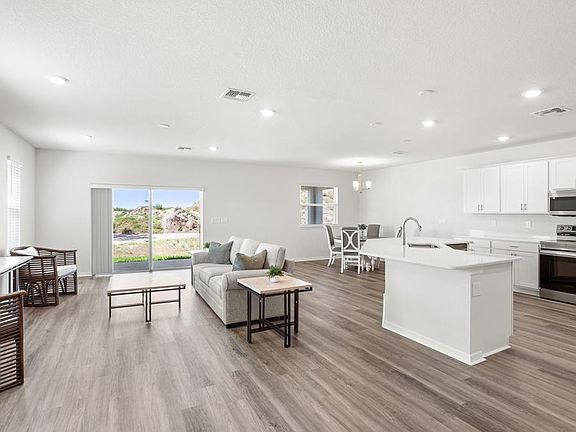 The living space is filled with natural light - Wesley II by Highland Homes