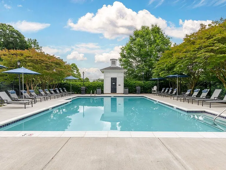 Swimming pool and sundeck with lounge seating