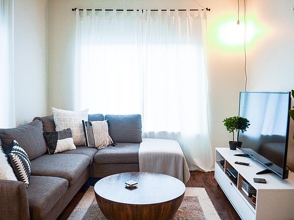 Living Room with plank flooring or similar