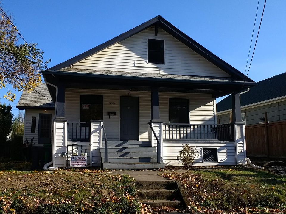 Great front porch...needs some nice chairs and containers of flowers! Yard to be re-landscaped in spring.