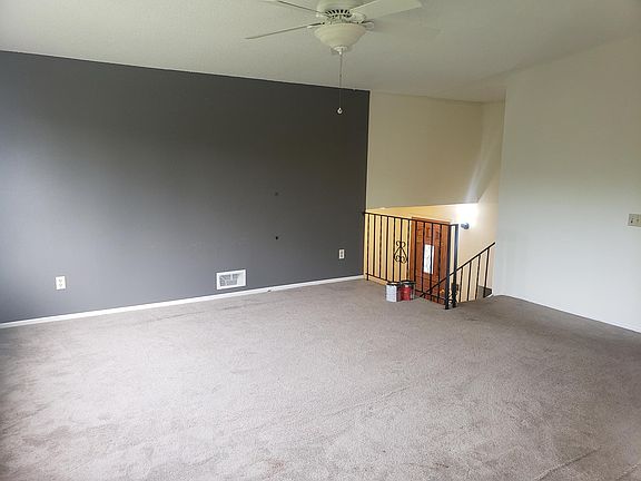 Living room and stairs going downstairs
