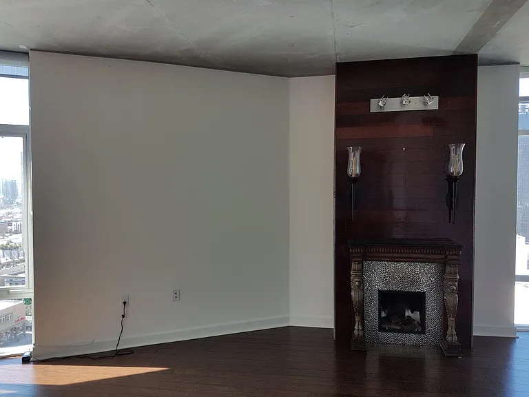 Living room with decorative fireplace facade