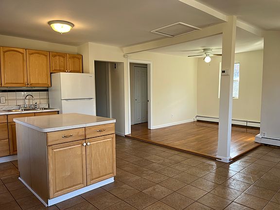 Open concept kitchen with nice size central island (Continued).