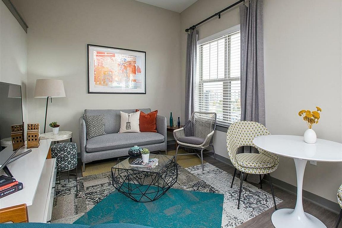 Experience comfort and style in this beautifully decorated urban living room.