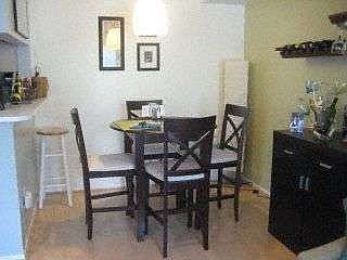 Dining nook adjacent pass through kitchen.