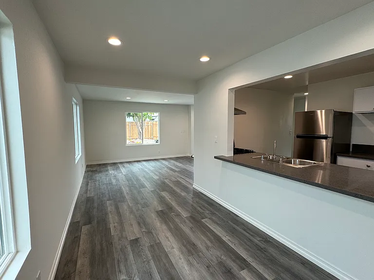 New quartz countertops in kitchen. Dining room opens to living room and kitchen and you can have bar stools at kitchen counter.