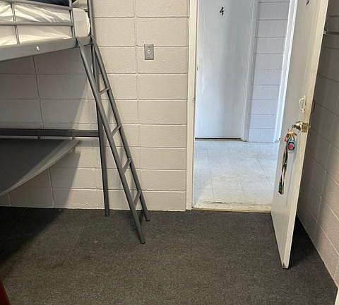 View from inside room looking into hallway