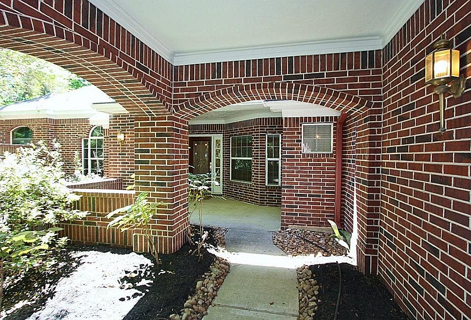 The all brick home greets you with this covered arch in the entry.