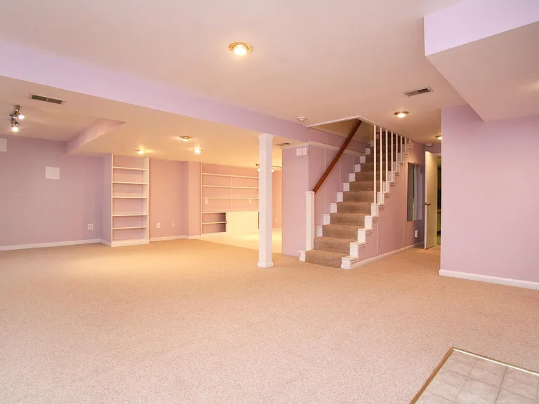 Spacious multi-functional finished lower level (now painted white).