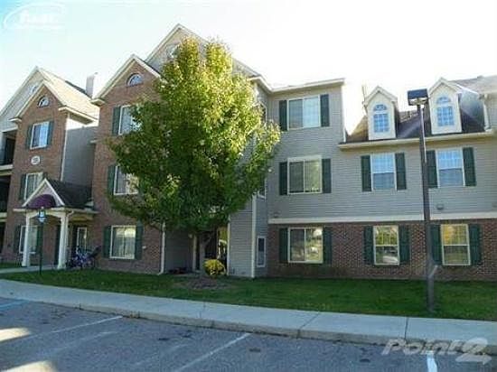 Prestigious first floor condo with living room facing the nature