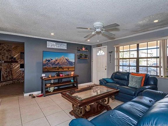 Living room leads to family room and laundry room