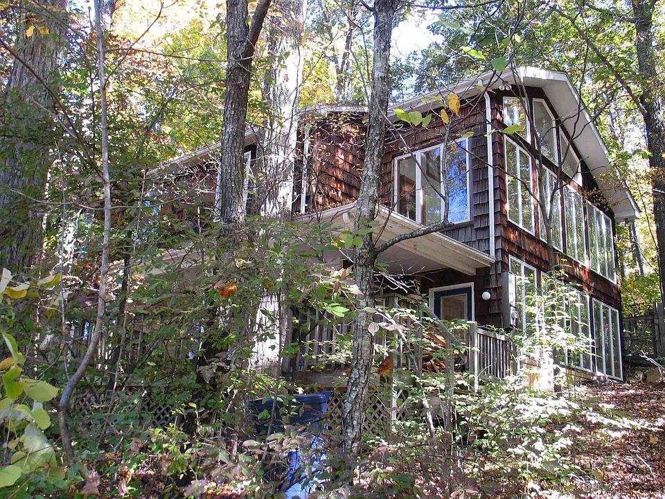 front of house showing 2 and a half story greenhouse