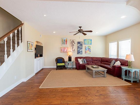 Living room with built-in's and beautiful wood flooring