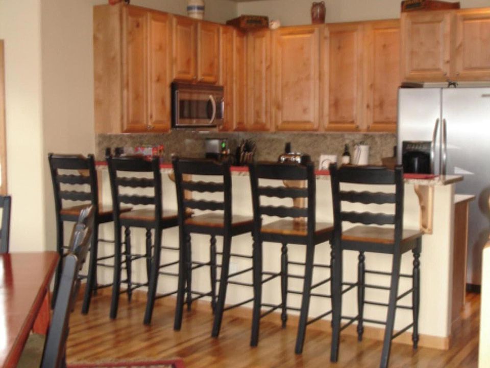 Kitchen Level with garage access, west facing balcony with natural gas BBQ