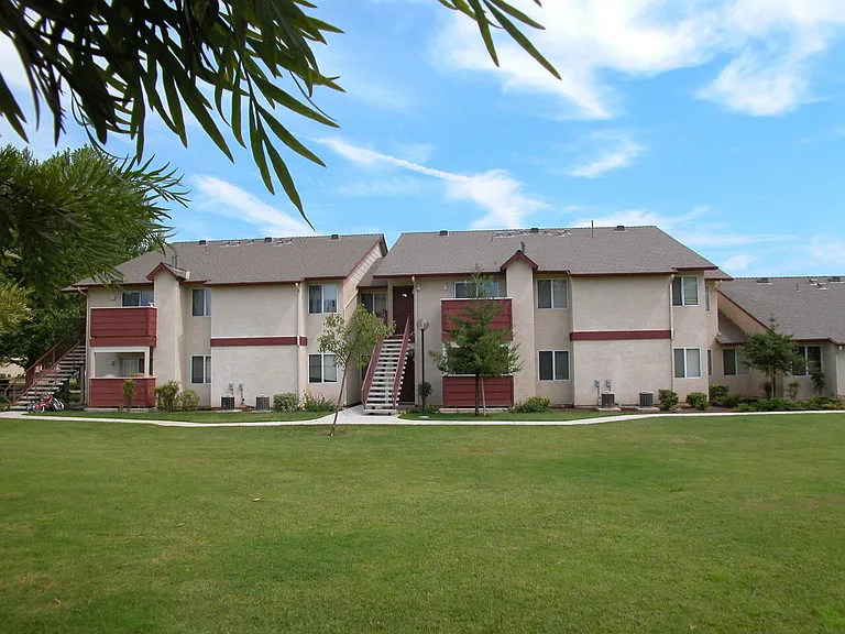 Building Exterior View From Grass Area