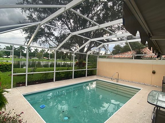 Private pool with screened enclosure
