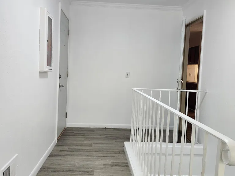 Rear stairwell, back entrance, zoomed in view of unit 3 back entrance