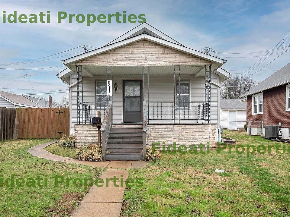 Front of house with porch and large yard