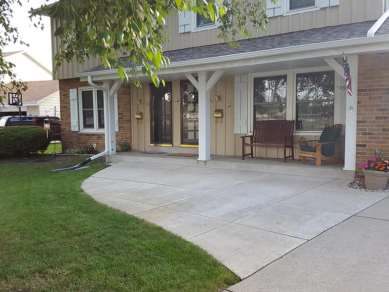 View from driveway Unit available on the left of photo