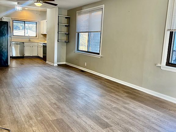 Additional view of living room and dining room.
