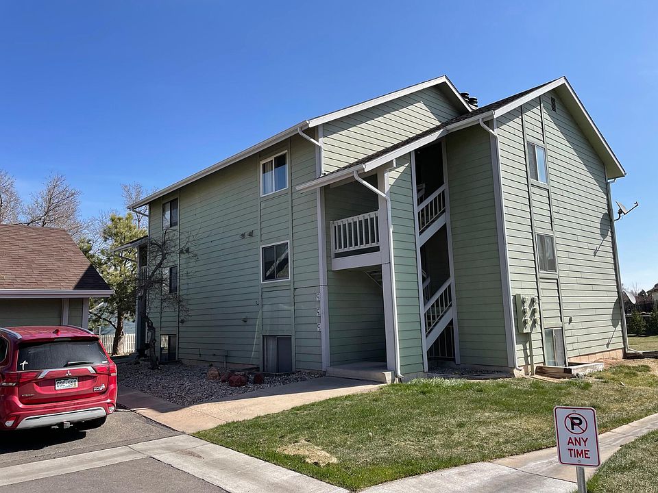 The property is on the top floor. Lot's of privacy! Garage is in front of the red car.