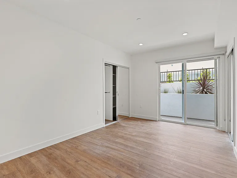 Bedroom with Two Closets with Built-In Shelving