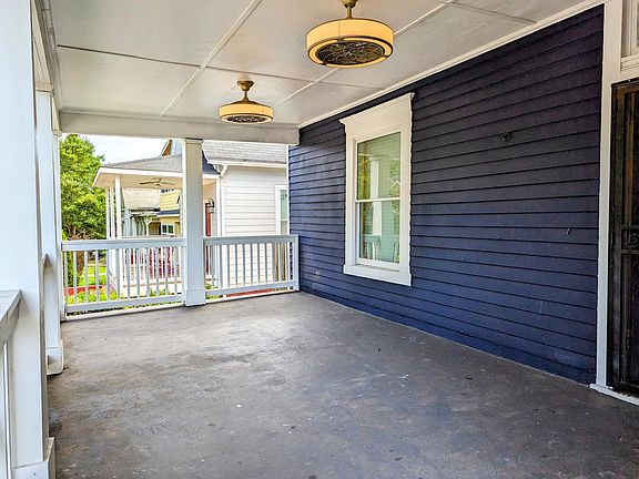 Front porch with double fan lights.