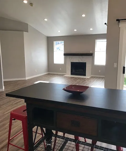 View from kitchen into living room, movable kitchen island