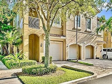 4861 Bonsai Circle Unit #213 a bright, quiet corner townhome