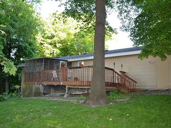 Back yard offers some privacy with the many trees. There is also a back yard fire pit.