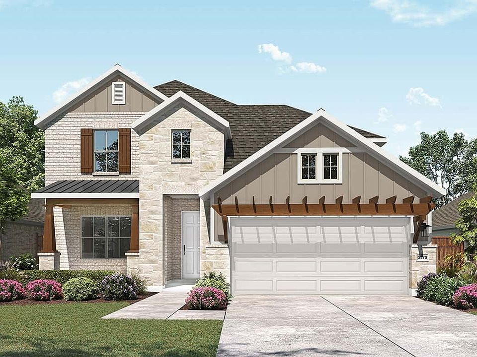 Elegant stone and brick design with a grand entrance in Taylor Estates. Meticulous landscaping compl