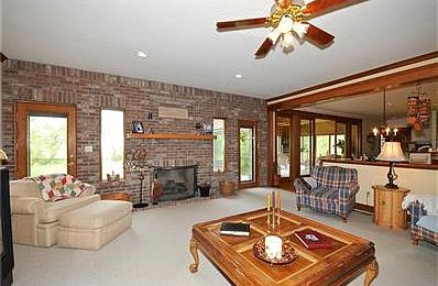 Cedar Four Seasons Sunroom with sliding doors on either side of room.
