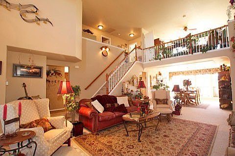 Another view of family room with stair case to upper level