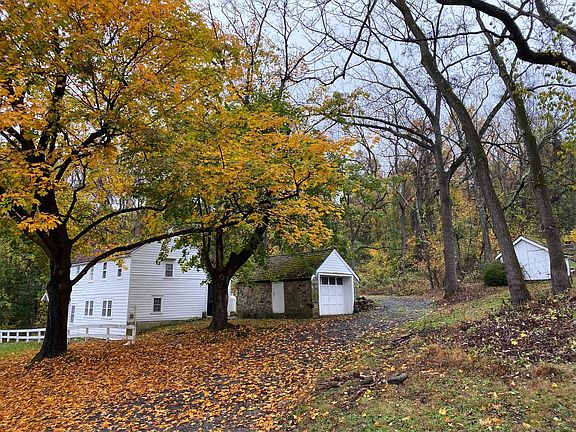 View of rental driveway, parking with room for at least 2 cars behind house.