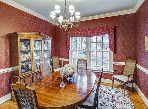 Dining Room - Measures 12.5 x 10.11 and opens to the Living Room and Kitchen. Gorgeous hardwood flooring, nice double window wit