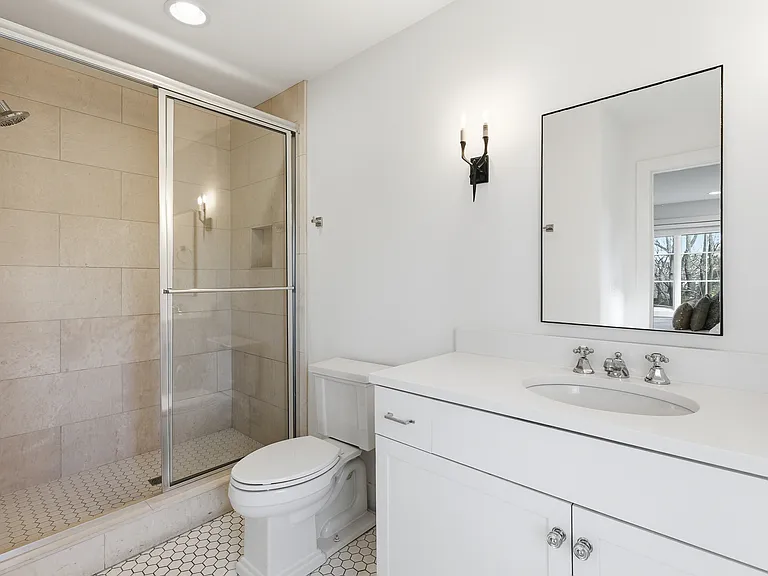 Full bathroom 2 is connected to bedroom 2 with a stand up shower.