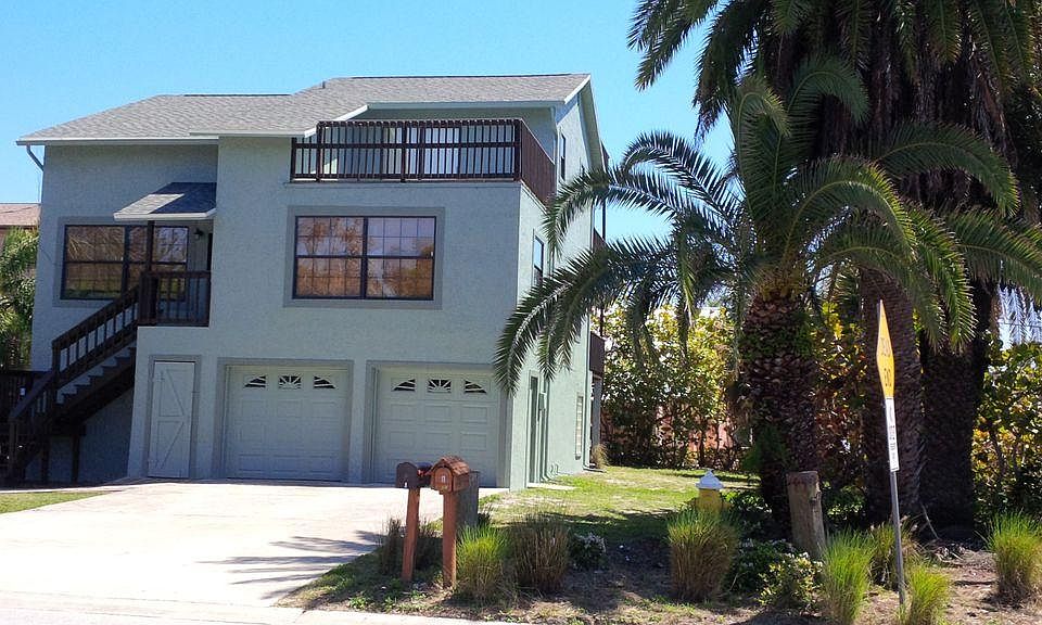 Front view (this is duplex so unit B is right side only, common front staircase with left side unit A, parking right side only includes garage access).