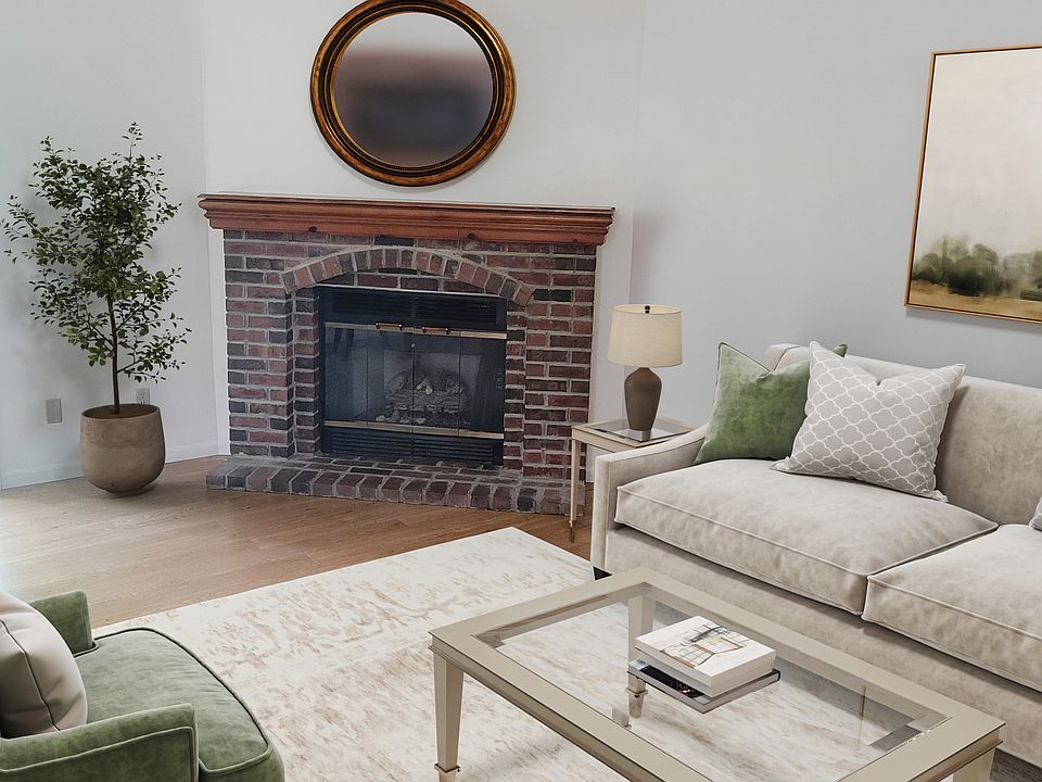 New flooring and lighting. Living room has access to lovely patio that backs to green space and has a privacy fence.