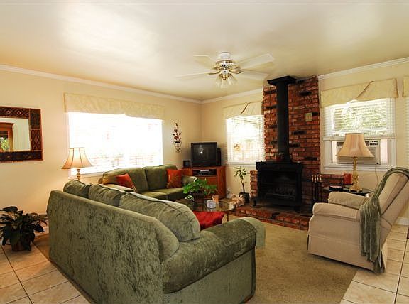 Living Room boasts wood stove and great mountain views