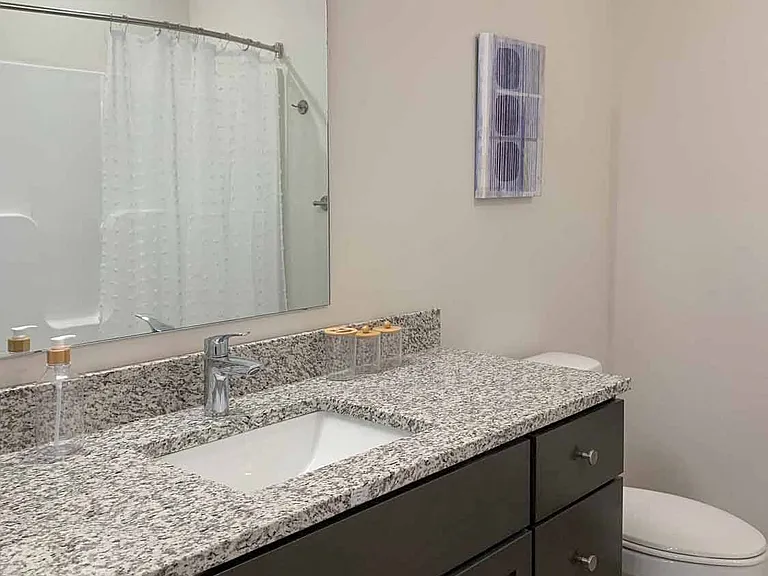 Our bathrooms include spacious vanities with ample storage, perfect for keeping your essentials organized and ready to use.