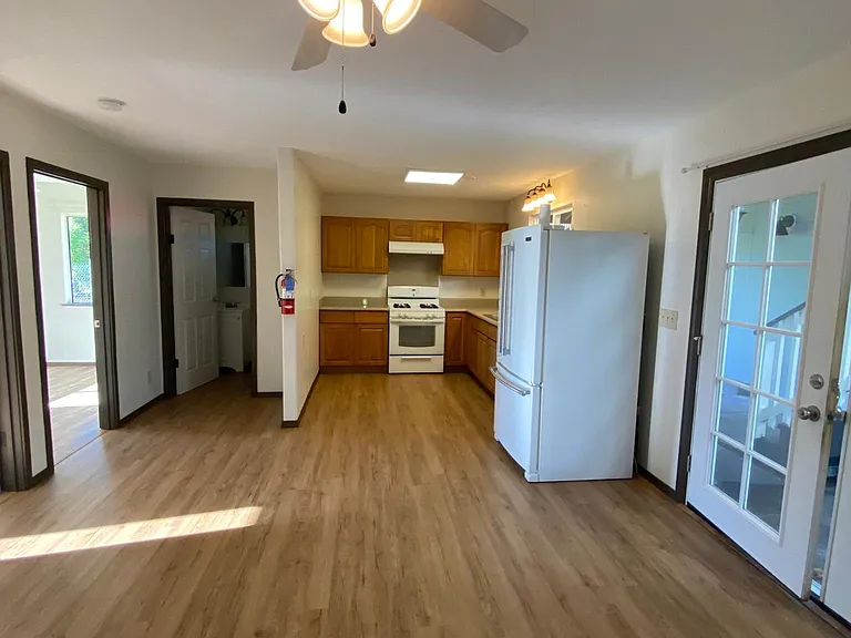 Downstairs (to right) view of kitchen/living room area.